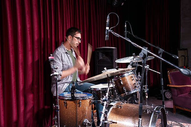 istock Drummer in Action During Rehearsal – Dynamic Moment Behind the Drum Kit 2211246269
