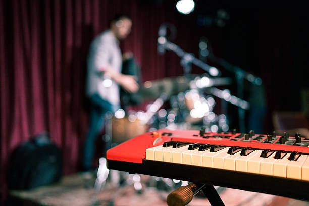 istock Keyboard in Focus – Band Rehearsal Scene 2211246272