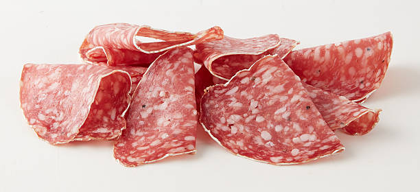 istock thinly sliced salami  isolated nature background with clipping path 2211247293