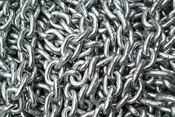 istock Metal chain texture. Industrial steel links. Silver iron chainpile. Strong secure material. Heavy duty construction. 2211247703