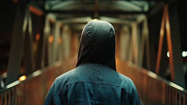 istock Man walking on pedestrian bridge at night. 2211247888