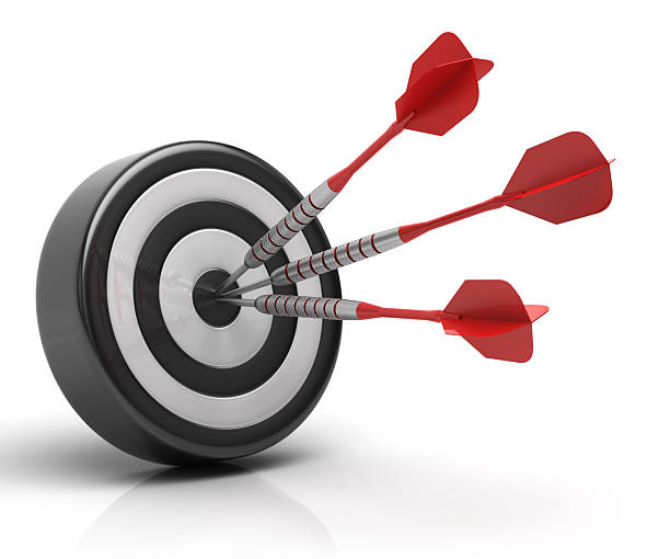 istock Success concept, three red darts hitting bullseye on dartboard 2211252253
