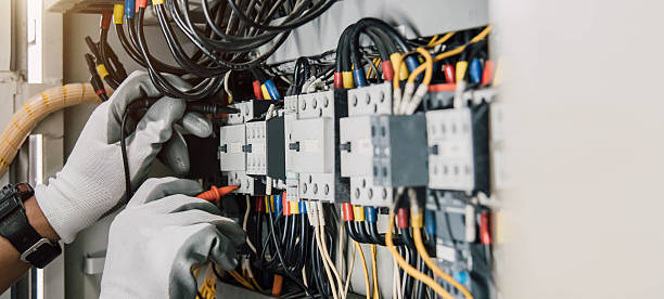 istock Electrician engineer tests electrical installations and wires on relay protection system. 2211255297