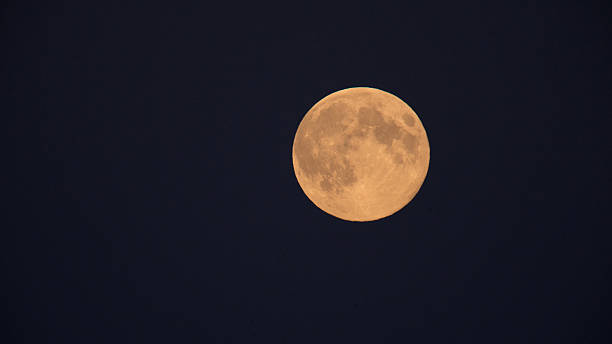 istock Close-up view of full moon at night.. 2211256334