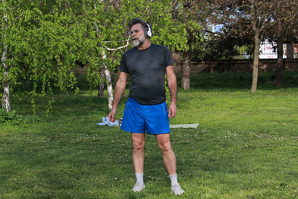 listen music senior bearded man relaxing training