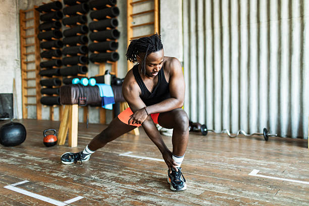 istock Sport person doing warming up before training in gym, legs stretching 2211260387
