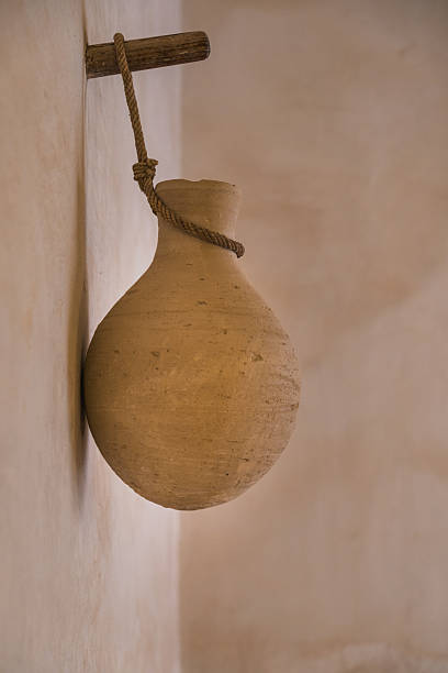 istock Traditional clay water jug hanging on a wall in oman 2211260562