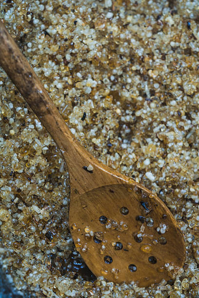 istock Wooden spoon scooping oman frankincense resin crystals 2211261511