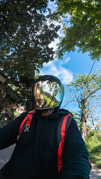 istock Motorcyclist with Reflective Helmet on a Sunny Day 2211262123