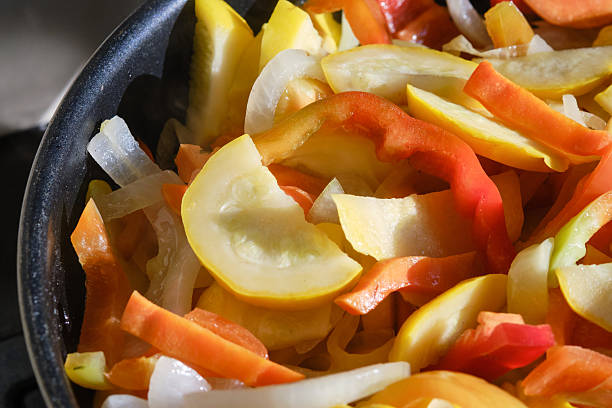 istock Fresh raw fried vegetables in a frying pan. 2211266432