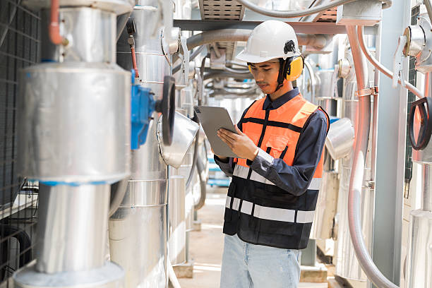 istock Utilities, Building utilities. Network of utilities on rooftop of building. Engineer worker inspecting quality of utilities system in sewer pipes area at rooftop of building area 2211271445