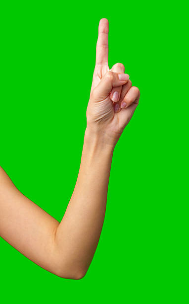 istock Hand gesture indicating number one with a green background during a creative or educational activity 2211273498