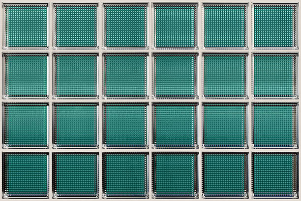 Turquoise glass block wall for interior design. Aesthetic and modern shape of textured. Capturing abstract patterns and light distortion. Building assortment for home, bathroom and office.