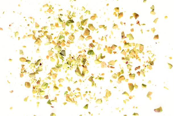 istock Pieces of peeled pistachio nut isolated on white 2211280335
