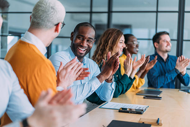 istock Businesspeople applauding during a seminar in conference hall. 2211282183