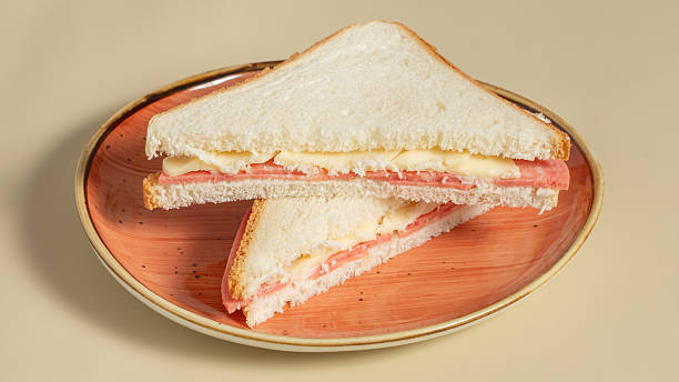 istock Club sandwich sliced in plate 2211286930