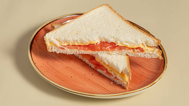 istock Club sandwich sliced in plate 2211286953