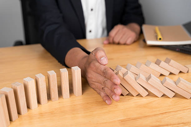istock Businessman placing wooden blocks on tower risk control concept. Planning and strategy in business. 2211287174