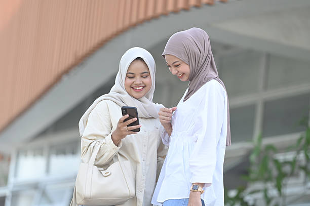 istock Asian women checking messages on smartphone 2211288603