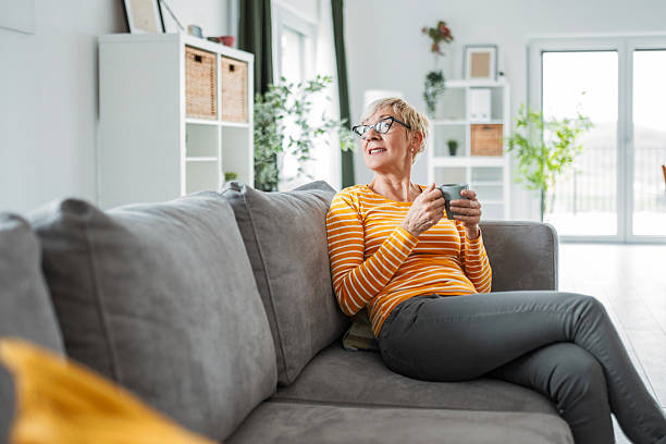 istock Thoughtful Senior Woman Relaxing with Coffee at Home 2211291207