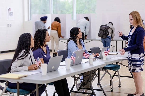 istock Election Day: Women Voting in a Polling Place 2211291608