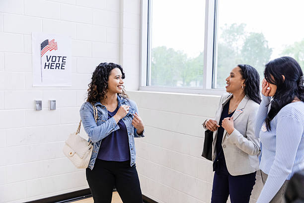 istock Three Women Smiling, Voting in USA Election 2211291644