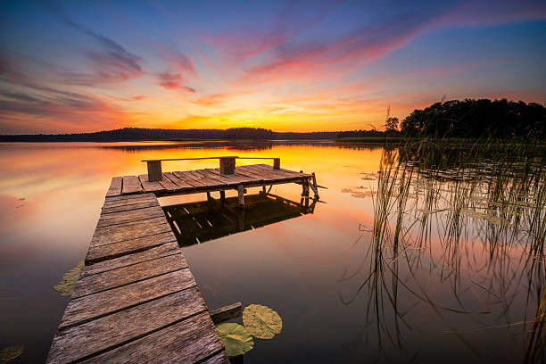 istock Beautiful summer sunrise over lake 2211293365