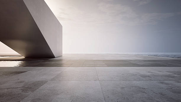 Empty concrete floor terrace near water.