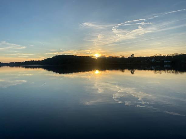 istock Serene Sunset Over Calm Lake 2211301333