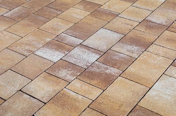 Self-locking concrete tiles for outdoor flooring. Background and texture.