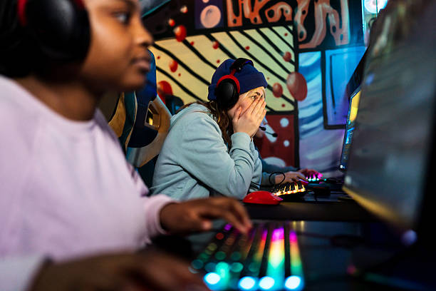 istock Frustrated gamer covering face while playing videogames 2211305181