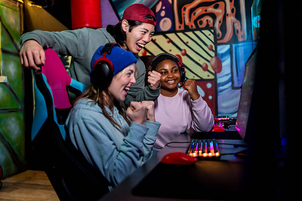 istock Excited gamers celebrating victory in front of computer 2211305261