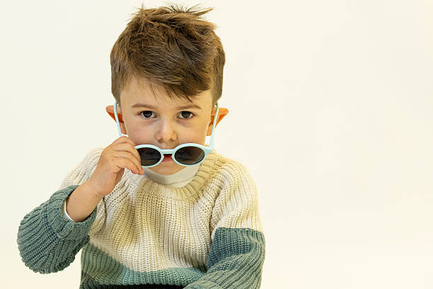 istock Happy caucasian children posing and playing in commercial studio with copy space 2211306109