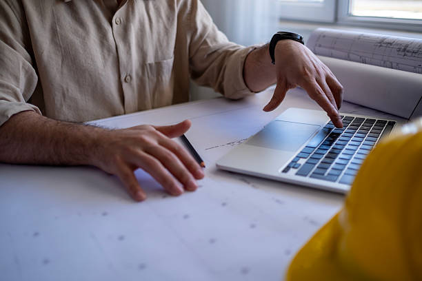istock Civil engineer helmet and laptop. 2211309480