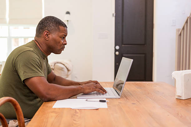 istock Military Man Working From Home on Laptop 2211314286