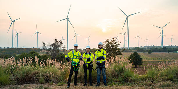 istock Engineer at Renewable Energy Windmill Farm, Harnessing Wind Power for Sustainable Electricity Generation, Advanced Technology to Support Green Energy Solutions, Eco-Friendly Alternatives Environment 2211315577