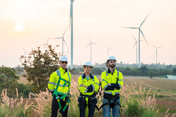 istock Technician and Engineer Working on a Windmill Turbine in the Field, Harnessing Renewable Energy for Sustainable Power Generation, Using Advanced Technology and Innovation to Support the Environmental 2211315578
