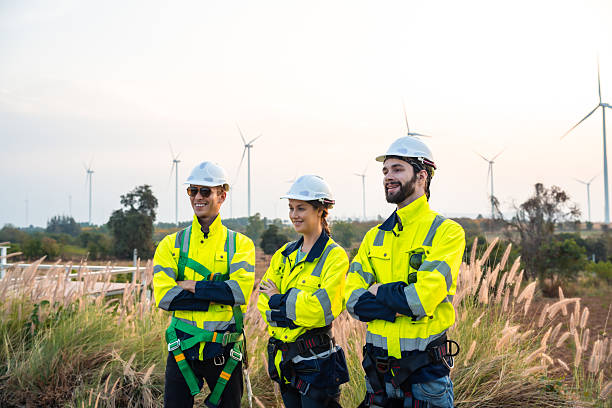 istock Technician and Engineer Working on a Windmill Turbine in the Field, Harnessing Renewable Energy for Sustainable Power Generation, Using Advanced Technology and Innovation to Support the Environmental 2211315583