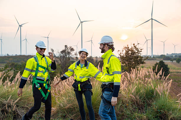 istock Technician and Engineer Working on a Windmill Turbine in the Field, Harnessing Renewable Energy for Sustainable Power Generation, Using Advanced Technology and Innovation to Support the Environmental 2211315609