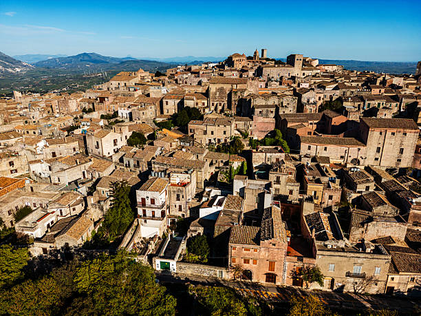 A scenic aerial view of Erice, Sicily, showcasing historical architecture, cobblestone streets, and rich cultural heritage in a charming medieval setting atop Mount Erice.