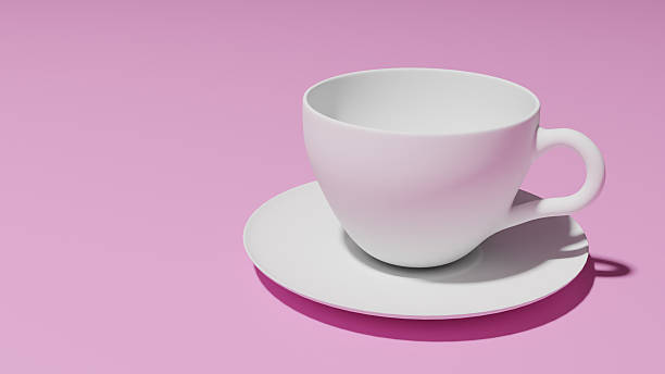 istock Minimalist image featuring a white cup and saucer on a pink background. Ideal for illustrating concepts like drink, refreshment, morning ritual or break time. 2211321695