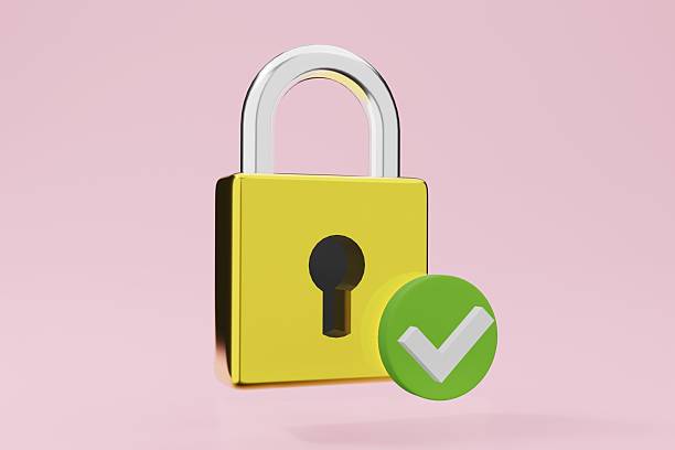 istock Stylized 3D render of a golden padlock with a green checkmark on a soft pink background. Represents security, safety, protection, and verification. Ideal for digital privacy, compliance. 2211321722