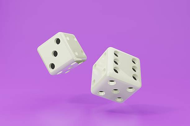 istock Two white dice in midair against a vibrant purple backdrop. Represents chance, risk, and opportunity. Great for gaming, decisionmaking, or luck concepts. 2211321723
