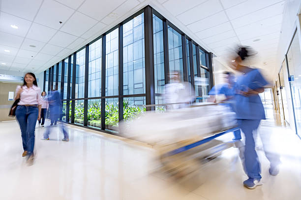People rushing in a busy hospital