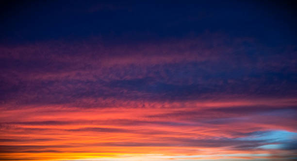 istock Uplifting Hues: Pink and Orange Light Embrace the Twilight Sky 2211324005
