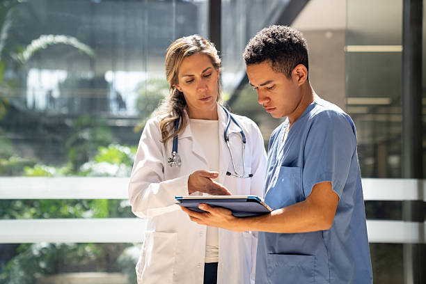 istock Nurse showing test results to a doctor using a digital tablet 2211325485