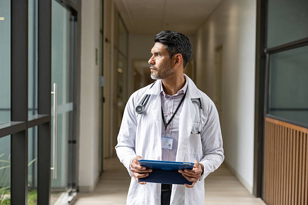 istock Doctor holding a digital tablet while working at the hospital 2211325564