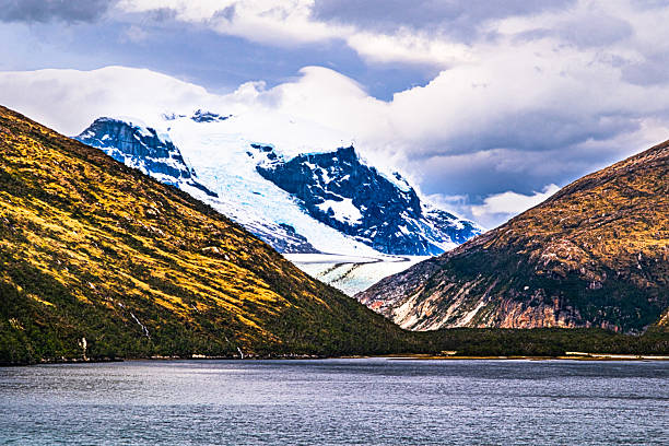 Alemania Glacier slowly flows downhill as seen from the Beagle Channel, Chile
