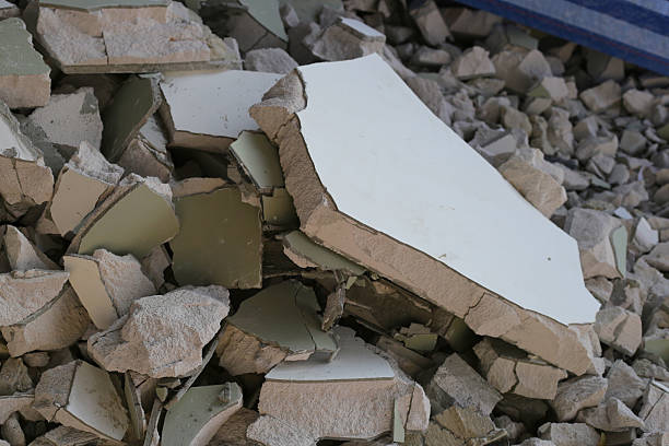istock Broken concrete, Piles of lightweight construction bricks after house demolition 2211341545