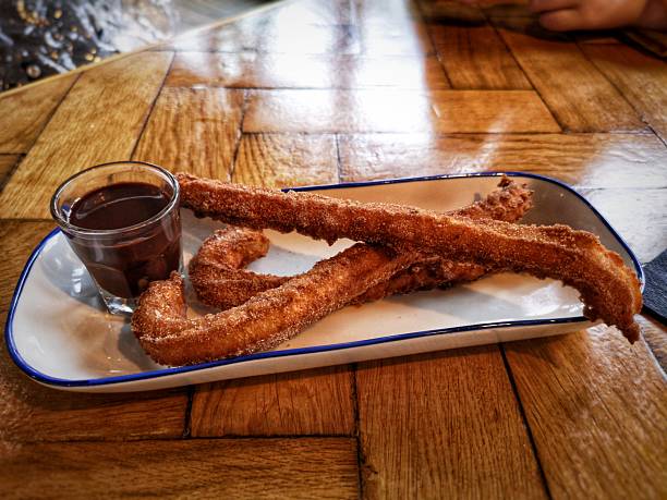 istock Mexican Churros with Chocolate Sauce 2211342133